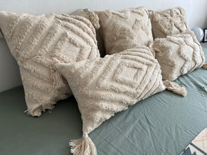 Boho pillow with beige tassels