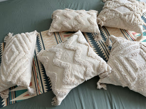 Boho pillow with beige tassels
