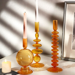 glass candlestick in orange | different designs